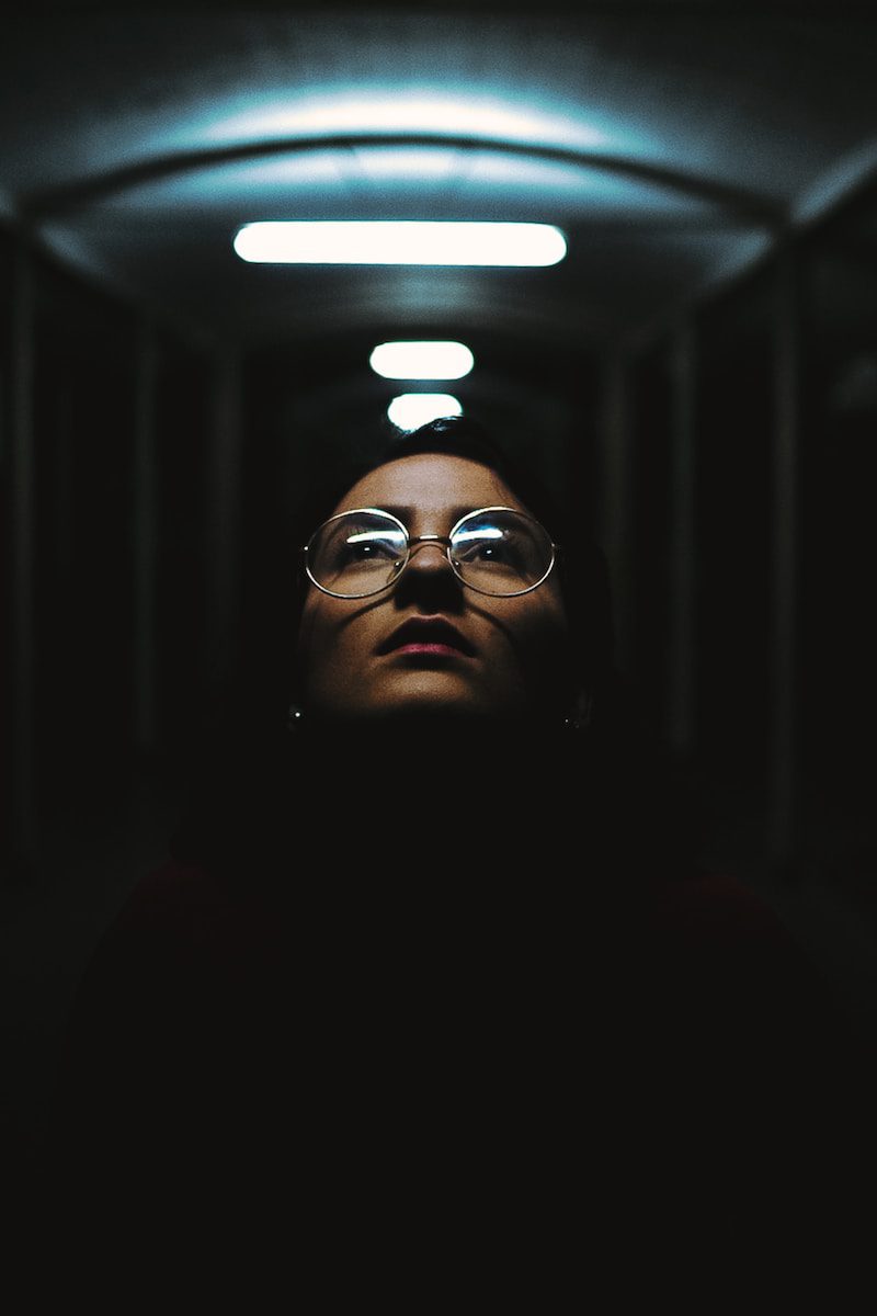 shallow focus photography of woman in clear eyeglases with silver frames