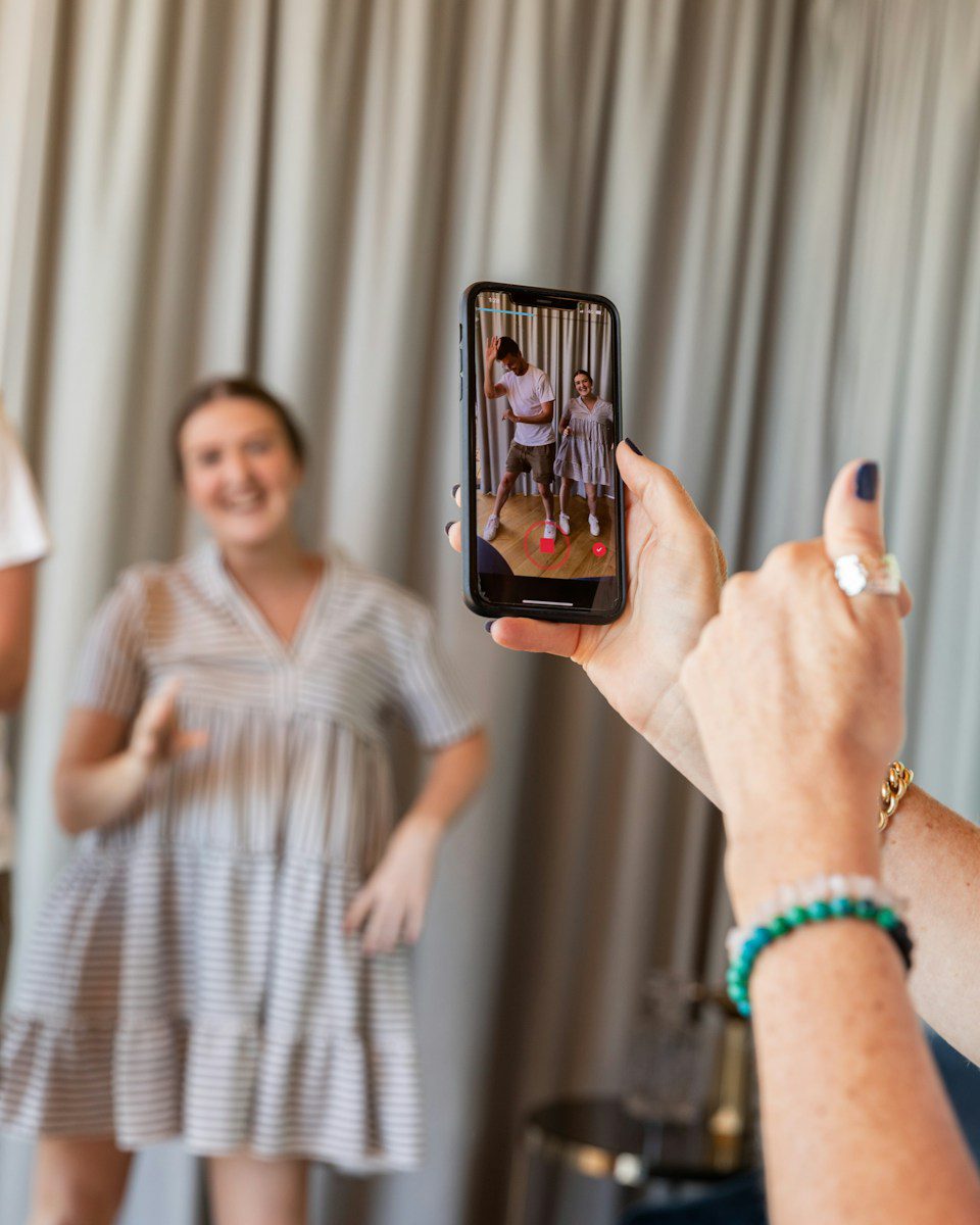 a woman holding a picture of a man