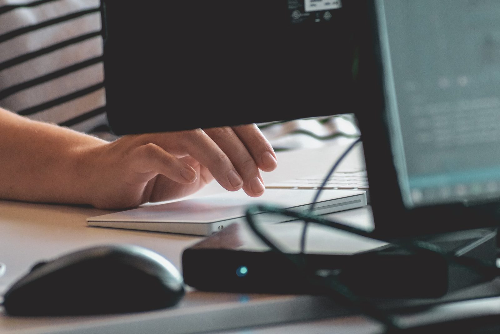 person using computer on table